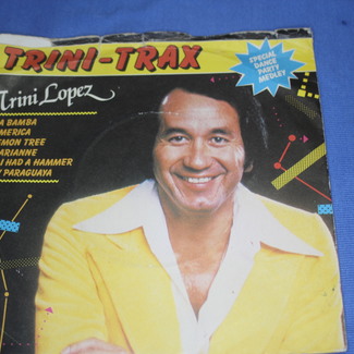 TRINI TRAX