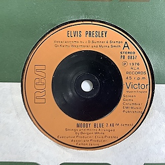 Moody Blue / She Thinks I Still Care by Elvis Presley