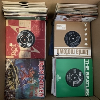 a joblot of about 250 7in vinyl records by Mixed Bag