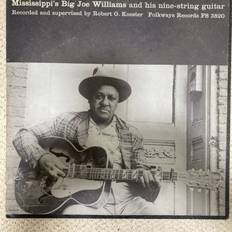 Mississippi Big Joe Williams and his nine-string guitar by M